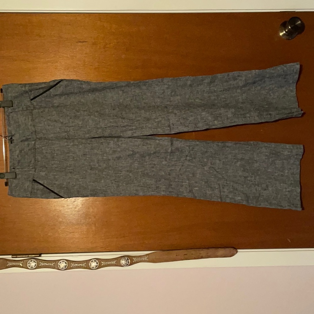 Gray slacks with black details on pockets and black buttons